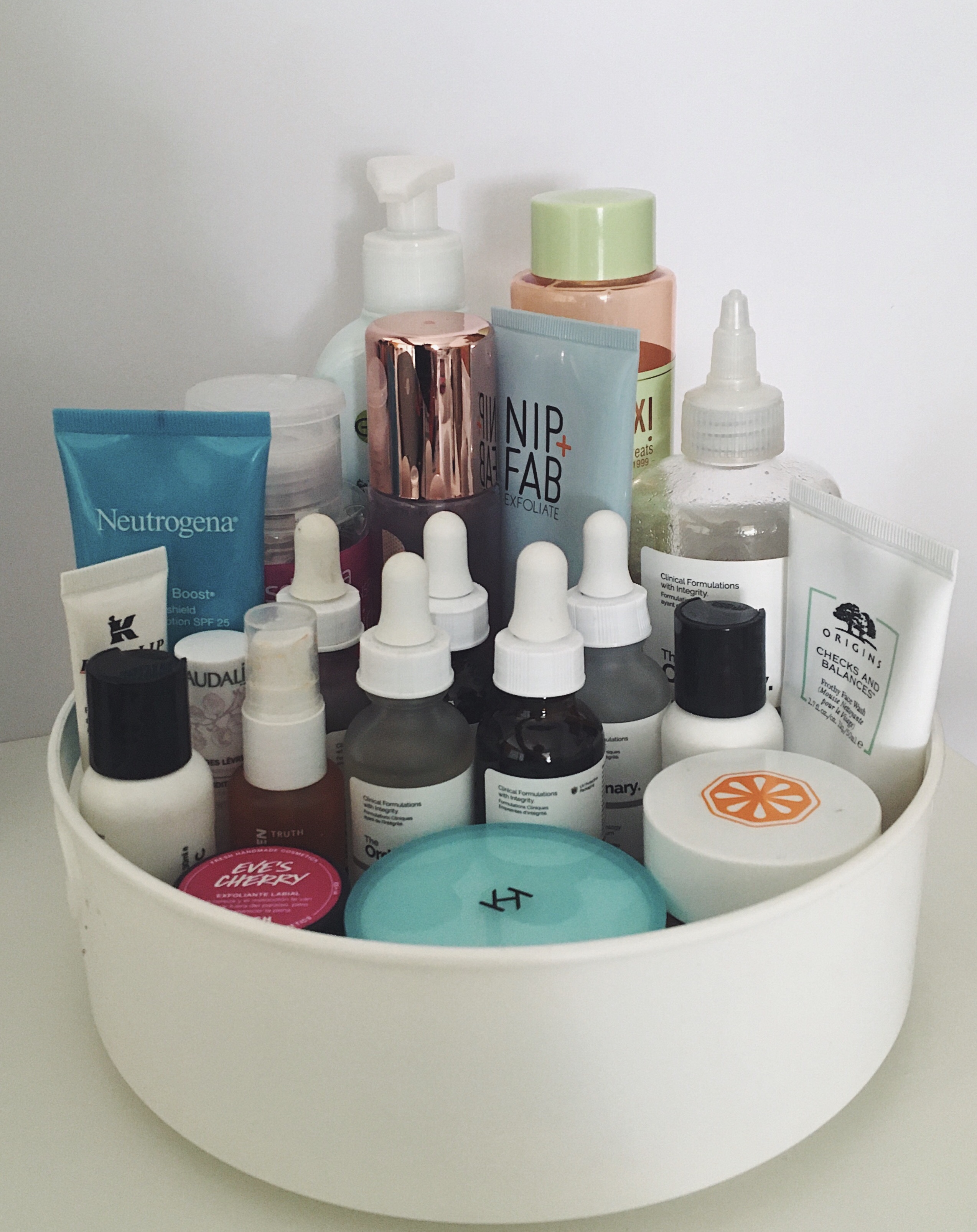 skincare products in a lazy susan spinning tub